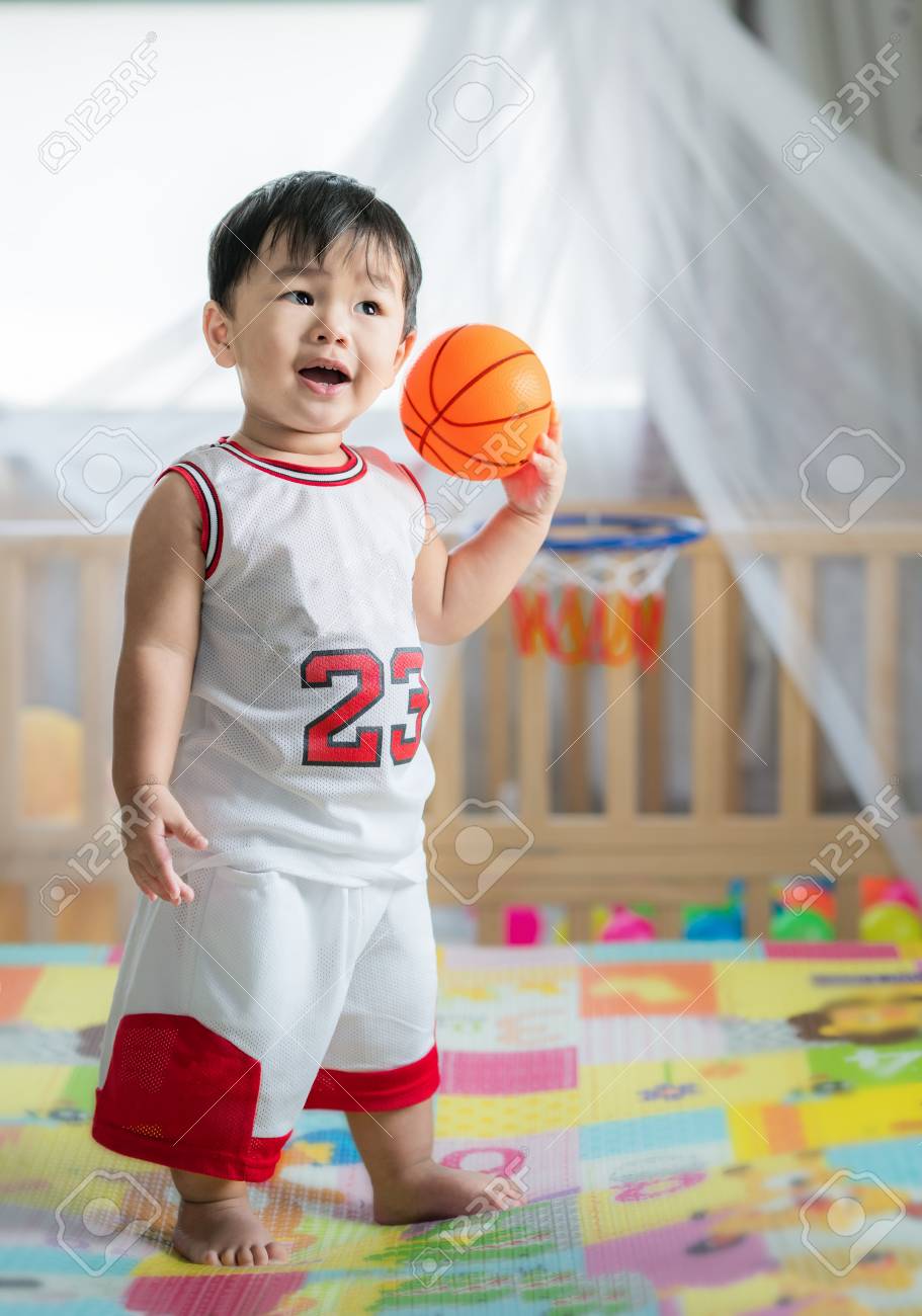 116523782-baby-with-ball-in-basketball-uniform-this-immage-can-use-for-play-sport-baby-child-k...jpg