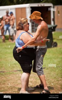 a-country-couple-dance-together-during-the-annual-summer-redneck-games-C5FNT8.jpg